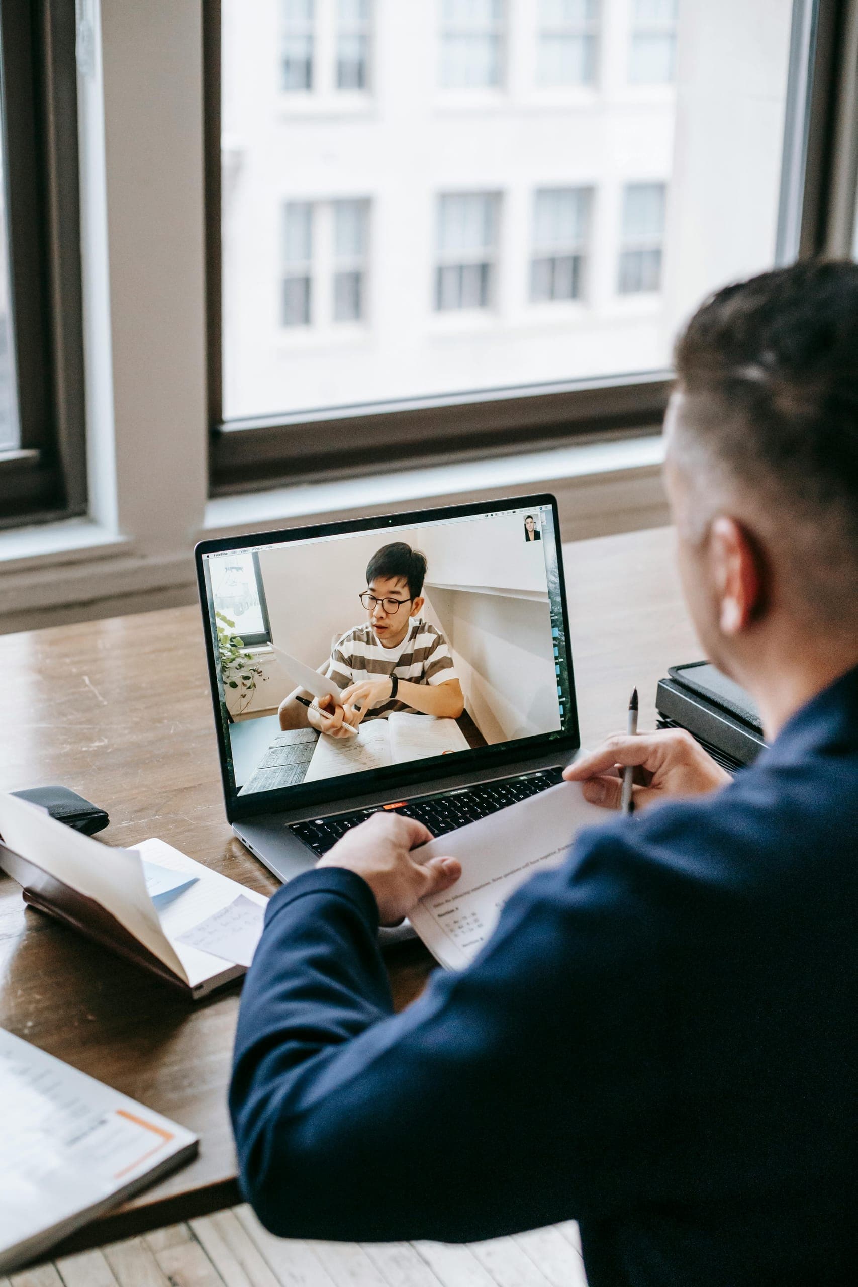 A mentor leading an online session with a student